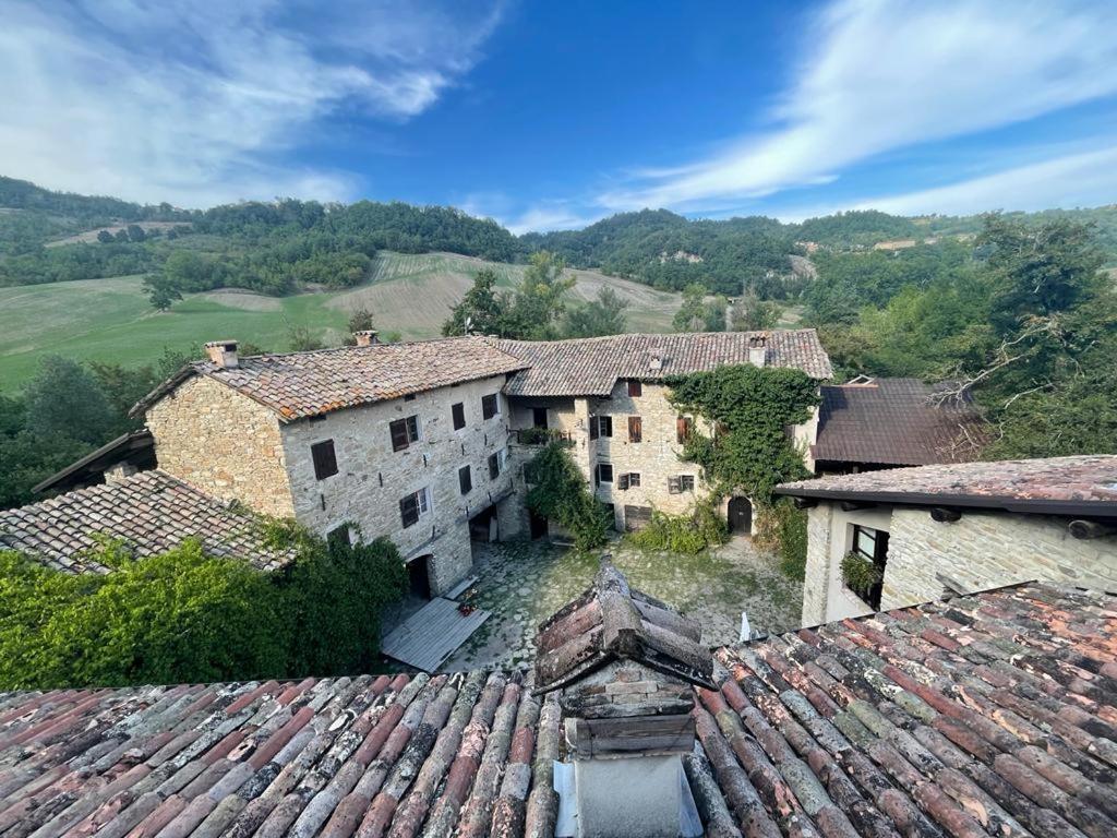 an aerial view of an old stone building with ivy at Agriturismo Mulino in Pietra in Casina