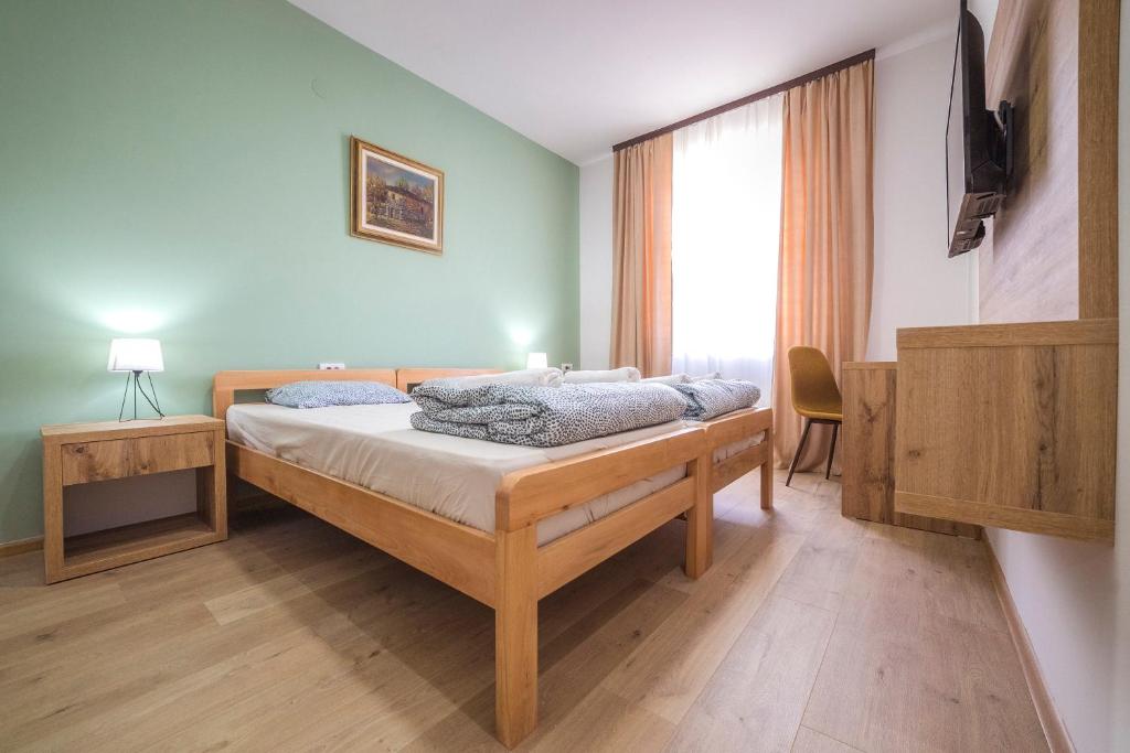 Postel nebo postele na pokoji v ubytování Zoe Pirot