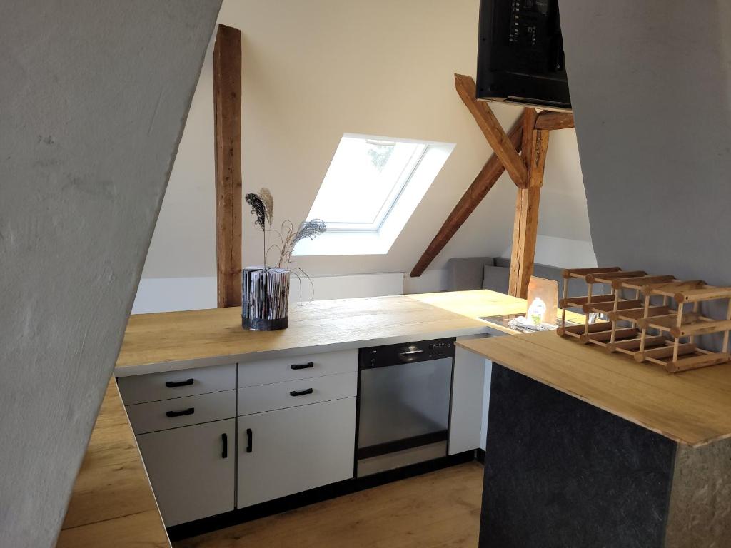 a kitchen with a counter top and a window at Quartier Mehrblick in Willingen