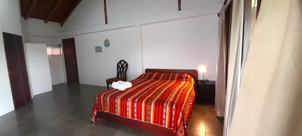 Postel nebo postele na pokoji v ubytování Hosteria Guachapeli