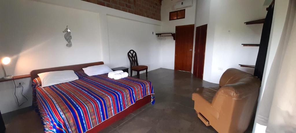 Postel nebo postele na pokoji v ubytování Hosteria Guachapeli