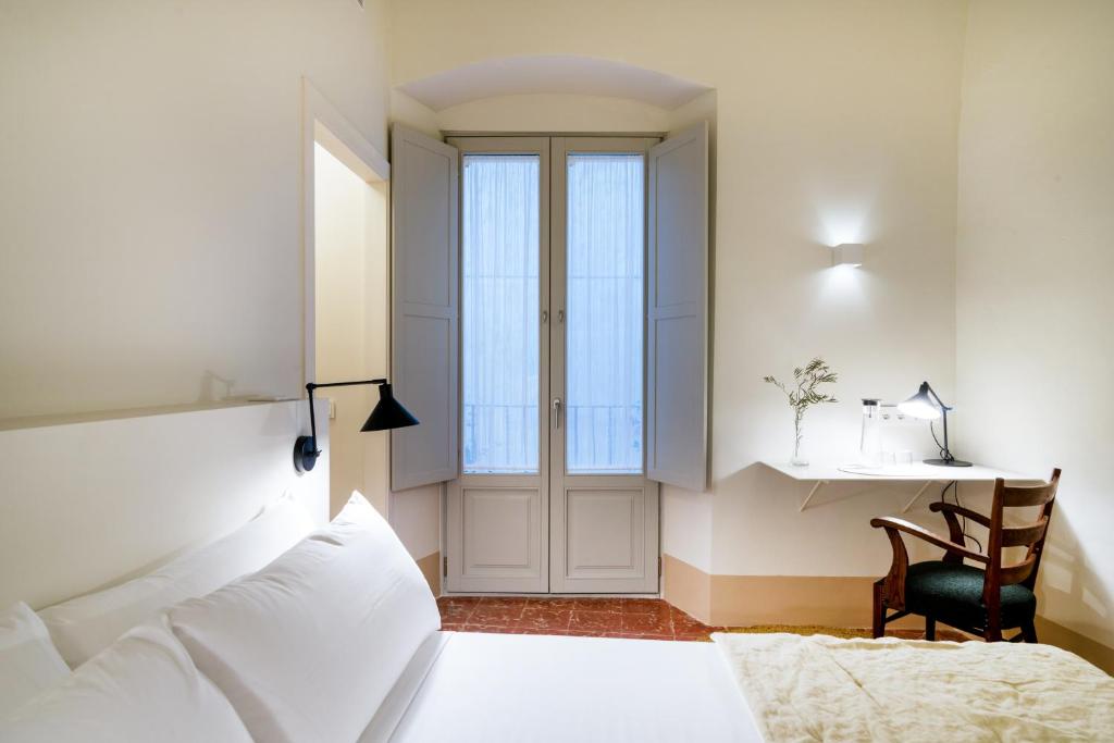 Postel nebo postele na pokoji v ubytování Can Mascort Eco Hotel