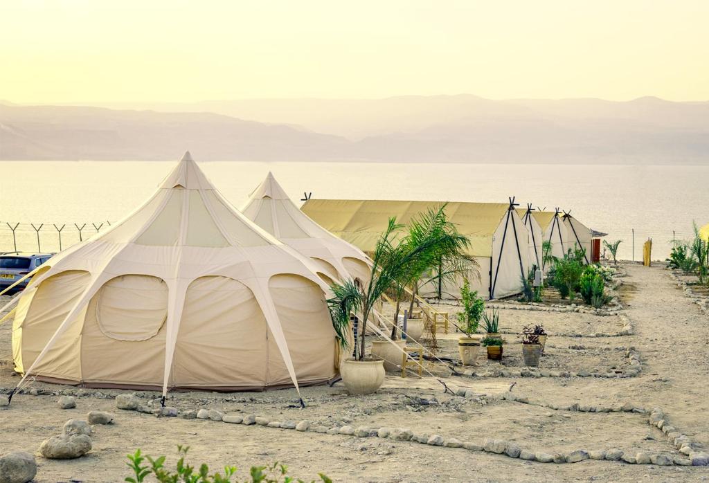 a tent in the middle of the desert at TRANQUILO - Dead Sea Glamping in Metsoke Dragot