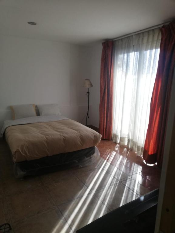 Cama o camas de una habitación en CasaHotel Centro - Huancayo