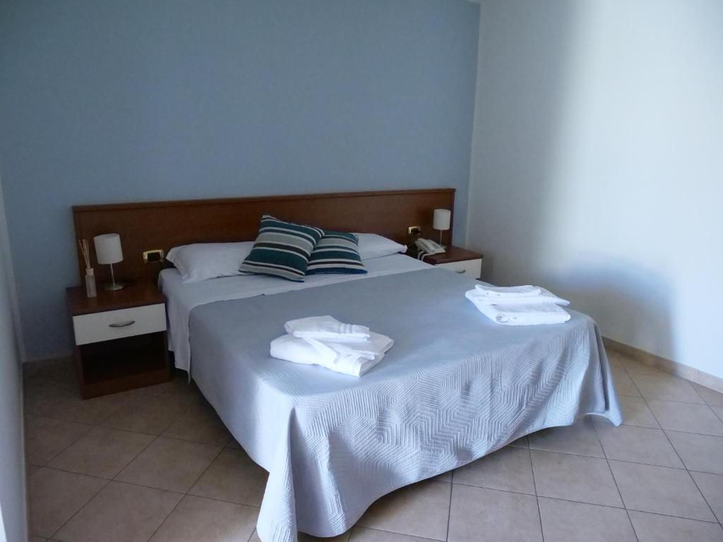Posteľ alebo postele v izbe v ubytovaní Grand Hostel Calabria