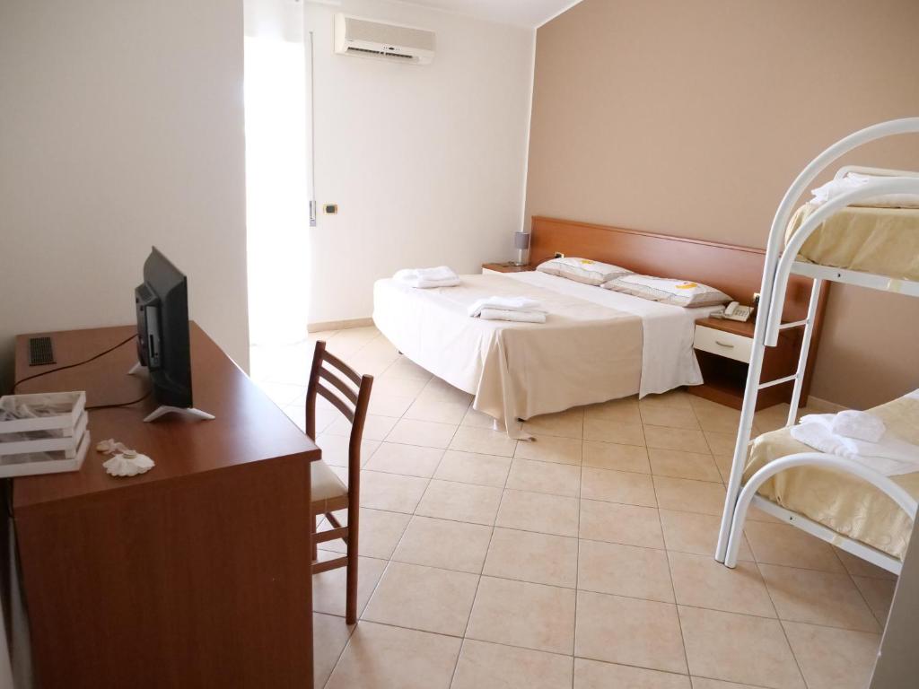 Posteľ alebo postele v izbe v ubytovaní Grand Hostel Calabria
