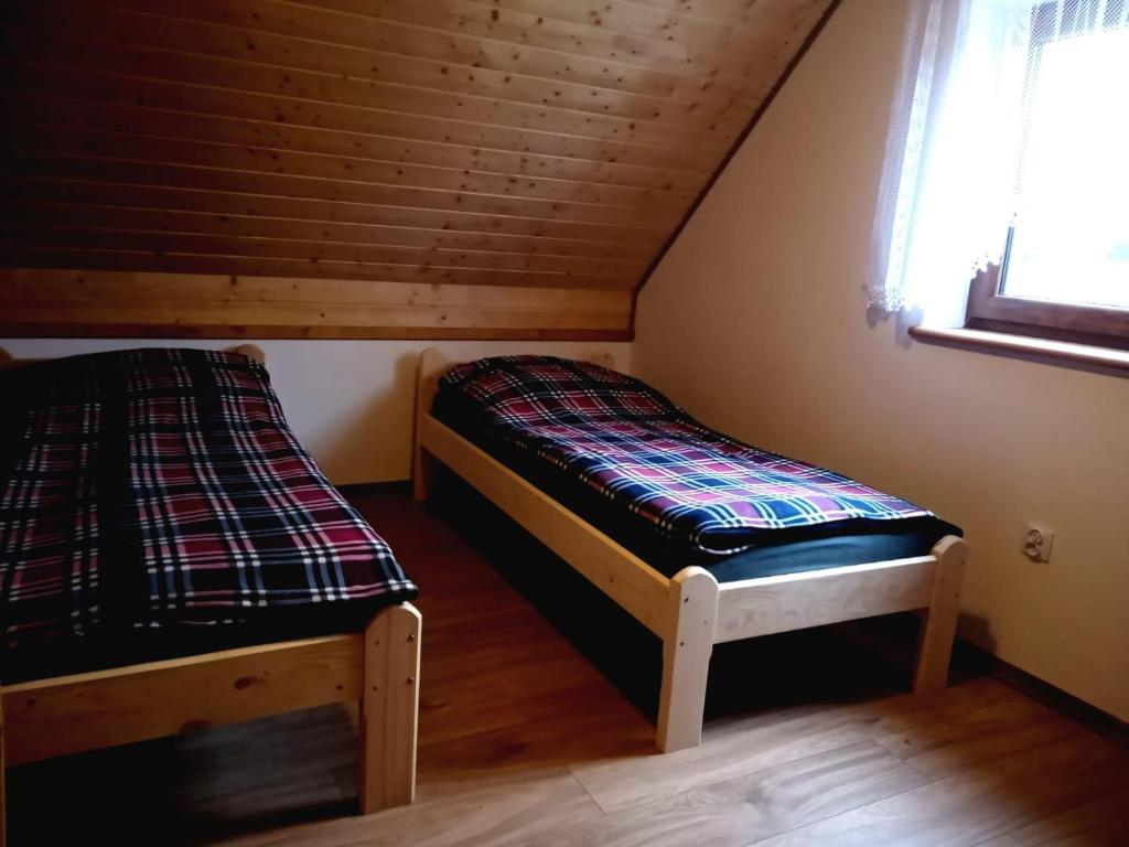 Posteľ alebo postele v izbe v ubytovaní Domki w Bieszczadzkiej Dolinie