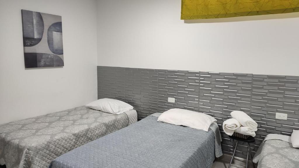 Postel nebo postele na pokoji v ubytování Apartamentos Las Piloneras