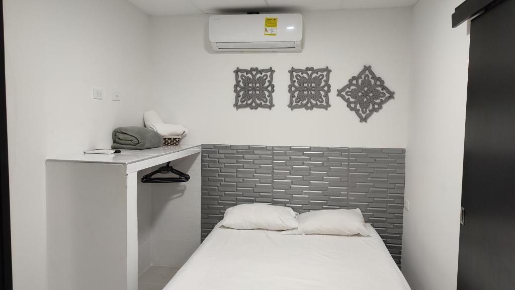 Postel nebo postele na pokoji v ubytování Apartamentos Las Piloneras