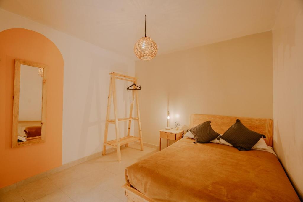 Postel nebo postele na pokoji v ubytování Hotel Cielo y Selva, San Cristobal de las Casas