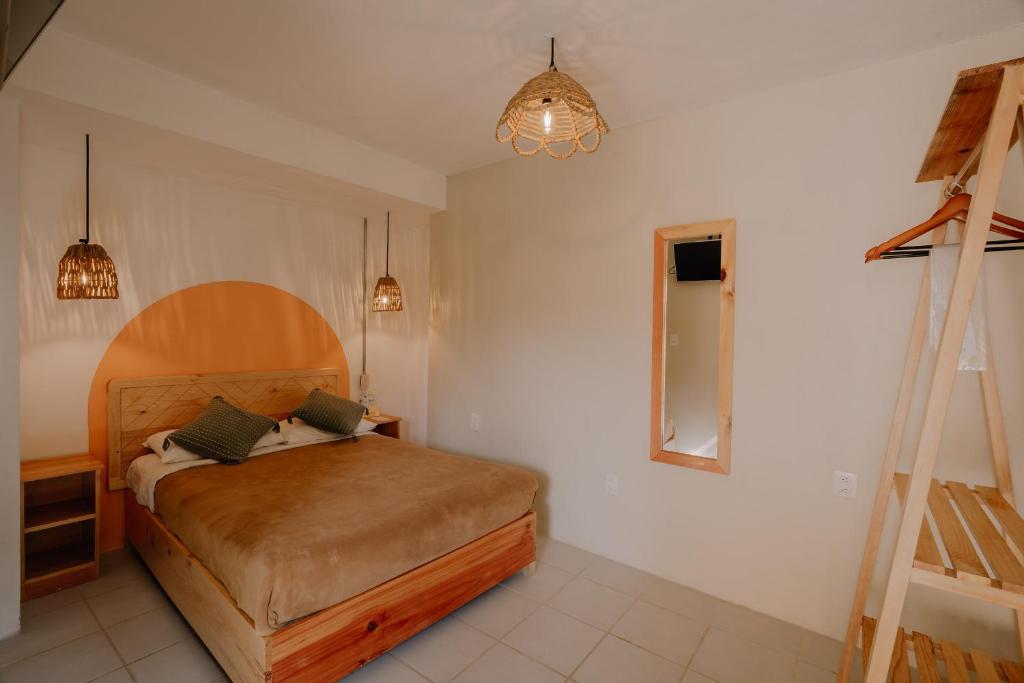 Postel nebo postele na pokoji v ubytování Hotel Cielo y Selva, San Cristobal de las Casas