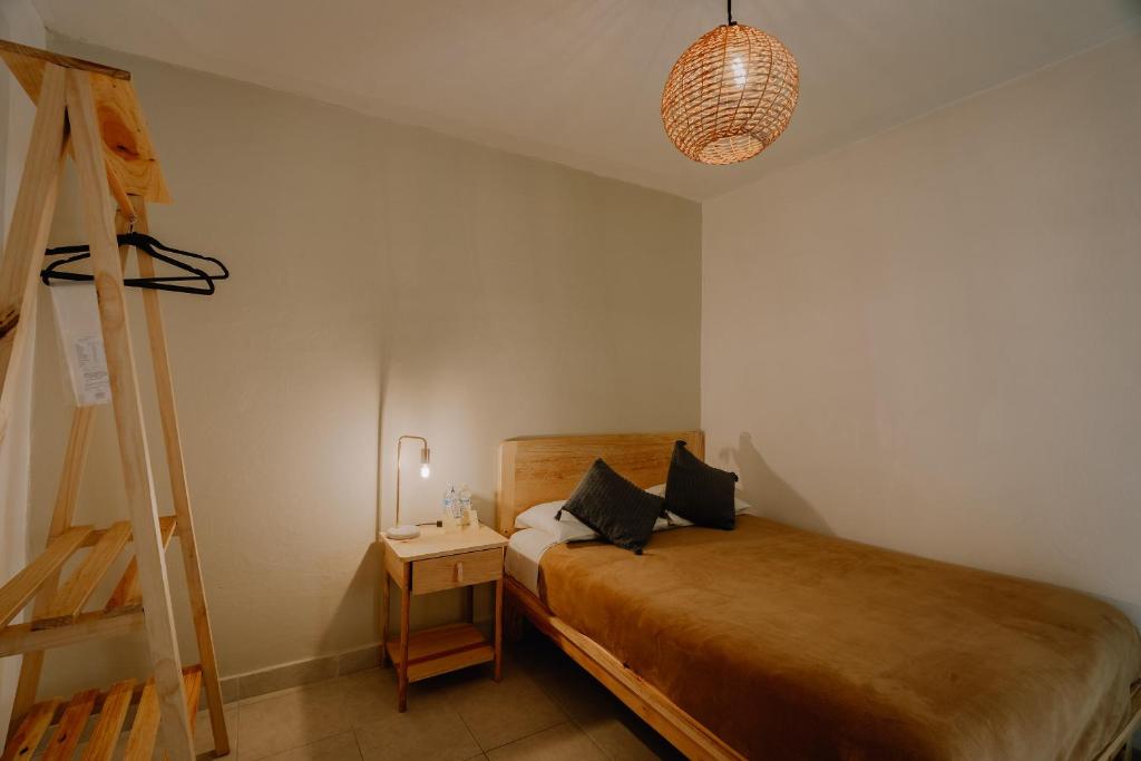 Postel nebo postele na pokoji v ubytování Hotel Cielo y Selva, San Cristobal de las Casas