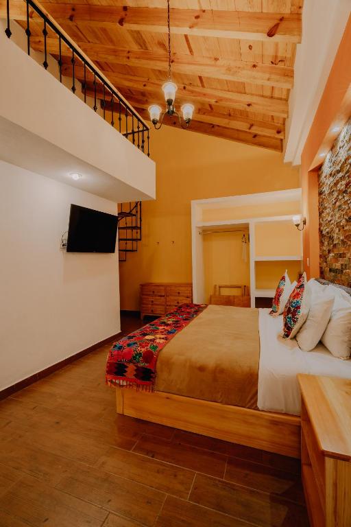 Postel nebo postele na pokoji v ubytování Hotel Cielo y Selva, San Cristobal de las Casas