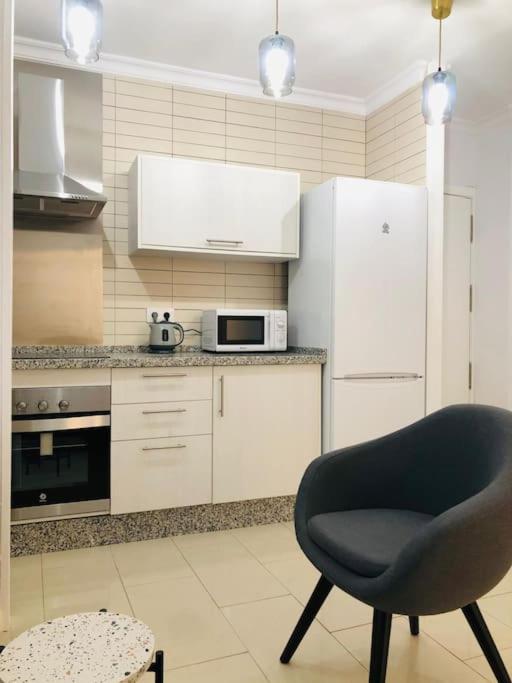 A kitchen or kitchenette at Nieves Viejas Apartamento Fresco con patio en Córdoba