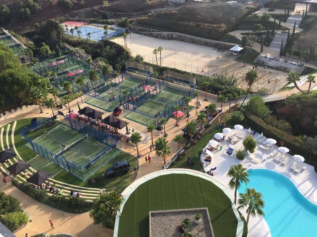 an overhead view of a tennis court and tennis courts at New apartment in Higueron West in Fuengirola