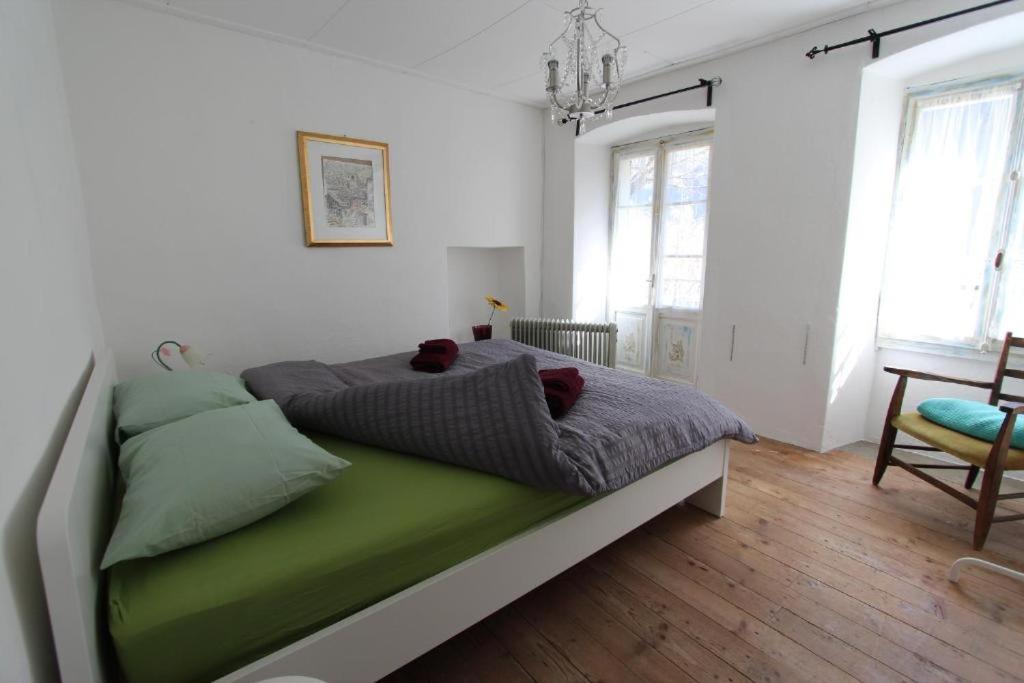 Postel nebo postele na pokoji v ubytování Camera in Casa Eva