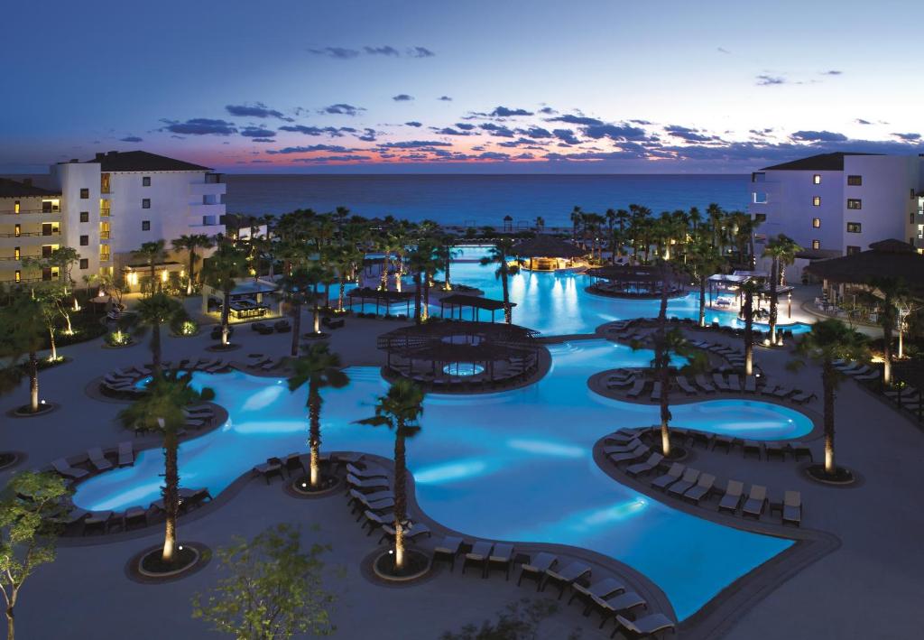 an aerial view of a resort at night at Secrets Playa Mujeres Golf & Spa Resort - All Inclusive Adults Only in Cancún