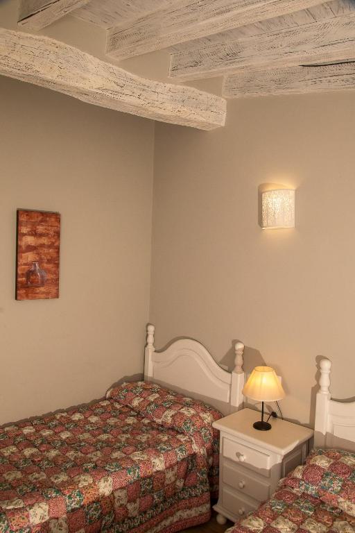 A bed or beds in a room at Apartamentos El Patio