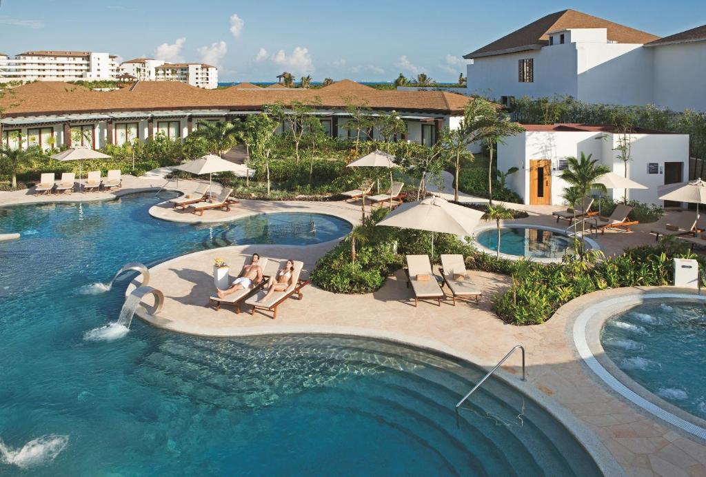 an aerial view of a pool at a resort at Secrets Playa Mujeres Golf & Spa Resort - All Inclusive Adults Only in Cancún