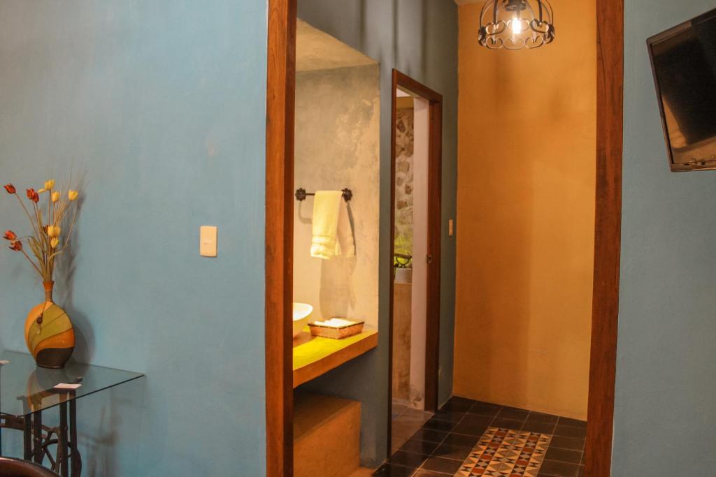TV a/nebo společenská místnost v ubytování Casa Vicenta Izamal