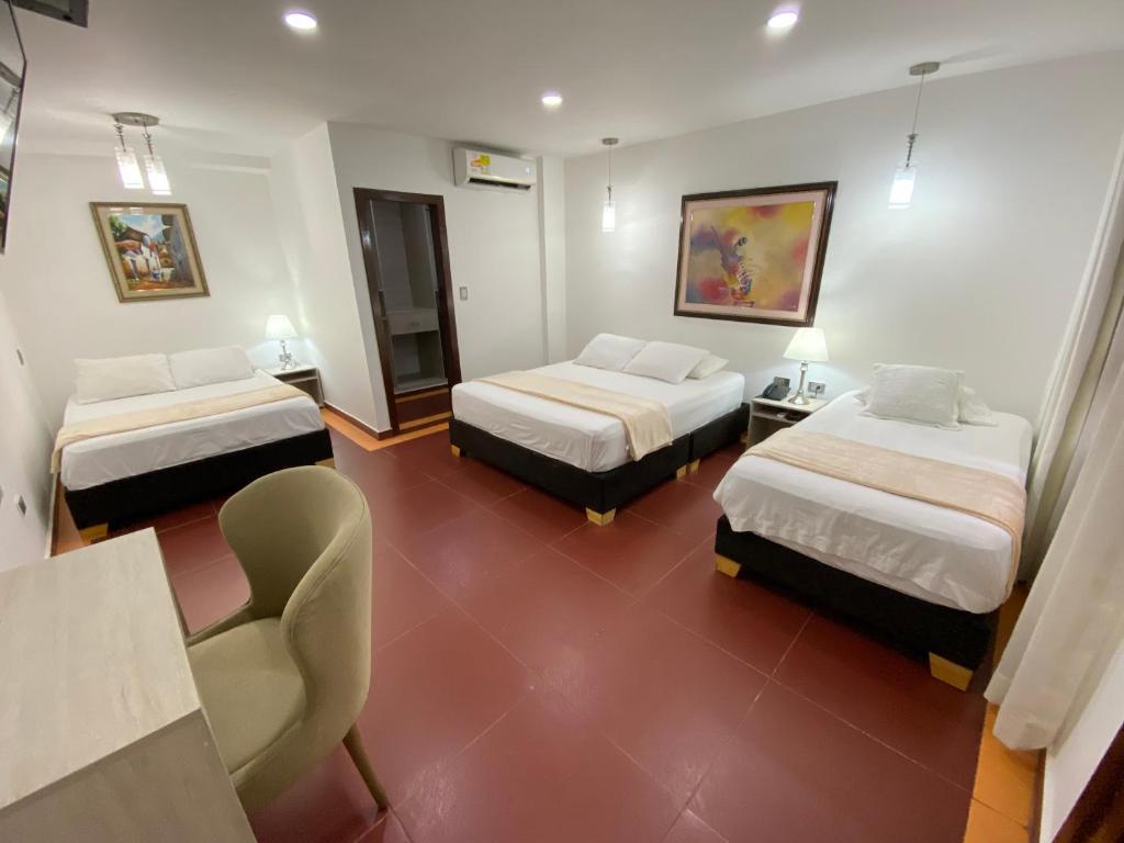 Postel nebo postele na pokoji v ubytování Hotel Casa Colonial