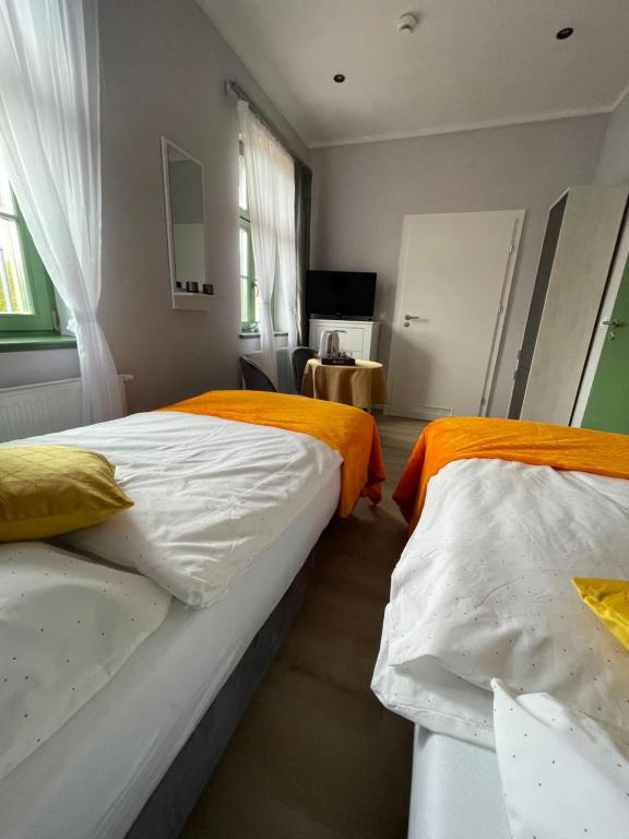 Postel nebo postele na pokoji v ubytování Pokoje Pod Mniszkiem