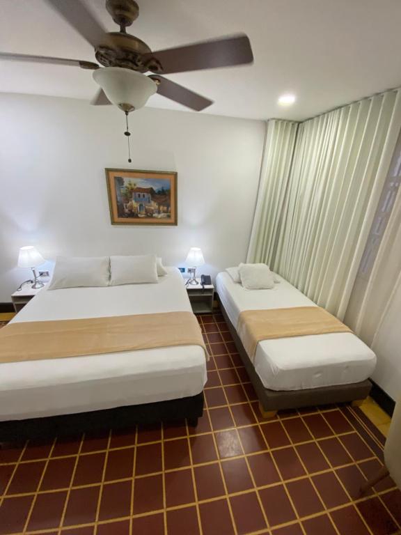 Postel nebo postele na pokoji v ubytování Hotel Casa Colonial