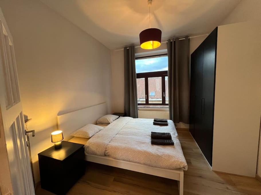 Gulta vai gultas numurā naktsmītnē Cosy Apartment Merode