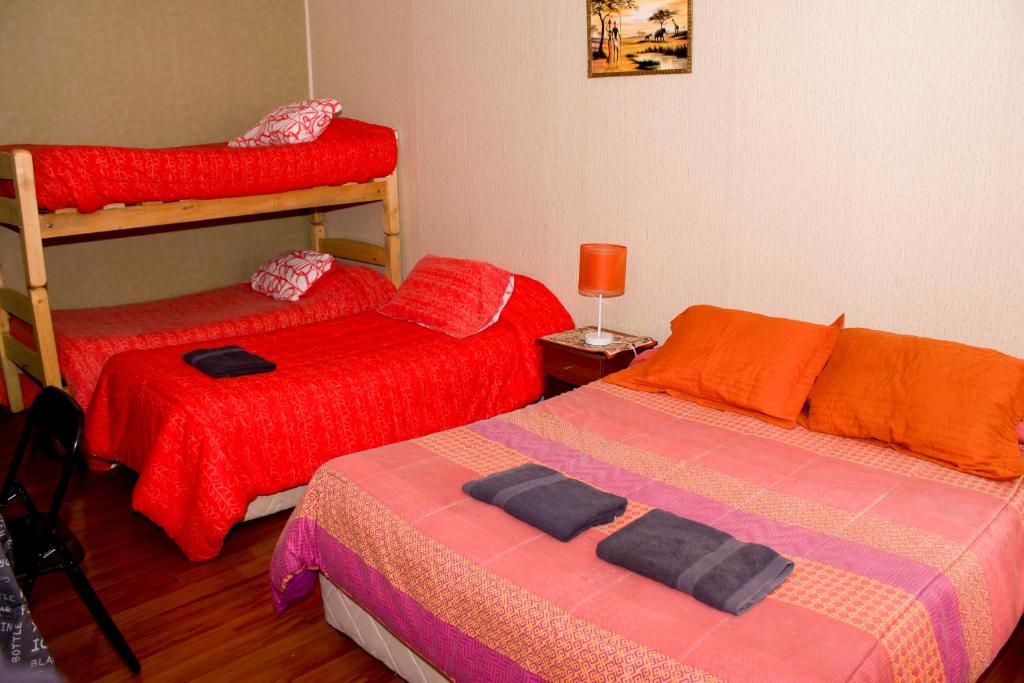 Postel nebo postele na pokoji v ubytování Hostal Residencia Blest Gana