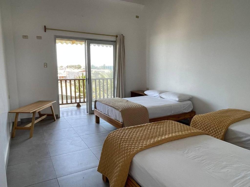 Postel nebo postele na pokoji v ubytování Samana Hostal, Puerto Engabao