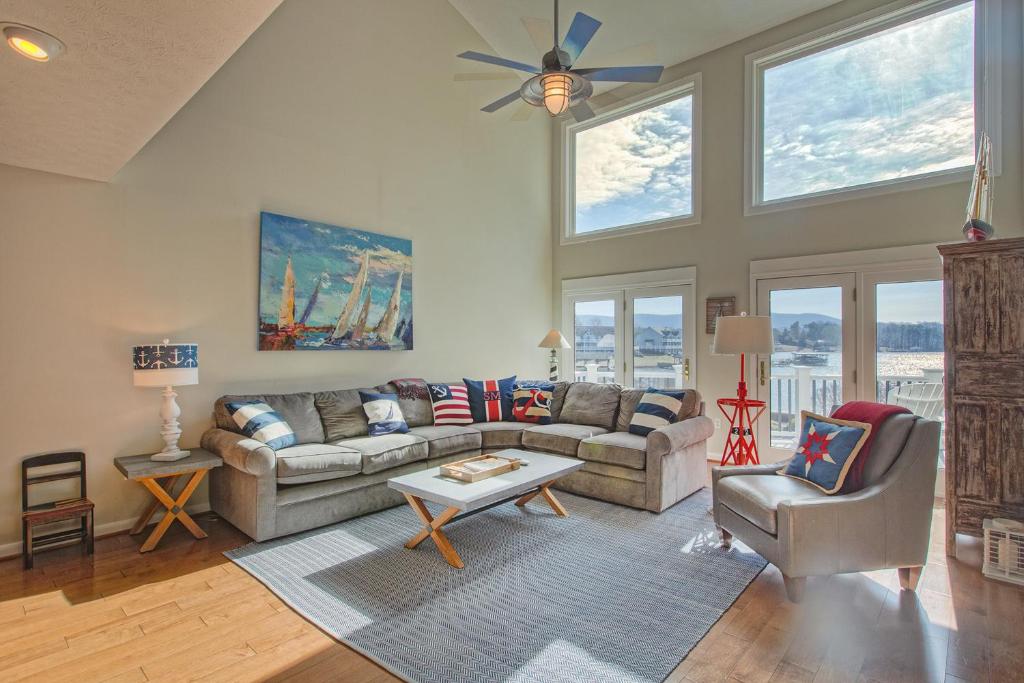 a living room with a couch and a table at Sail Away in Huddleston