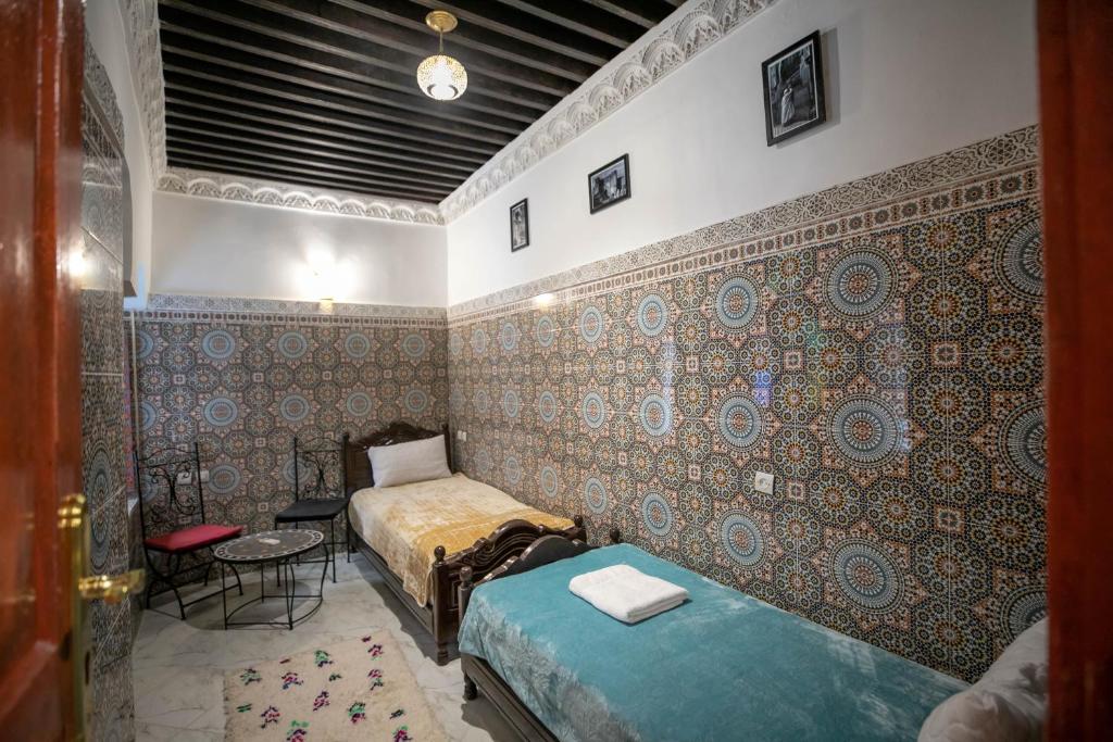 Postel nebo postele na pokoji v ubytování Riad Fes Unique