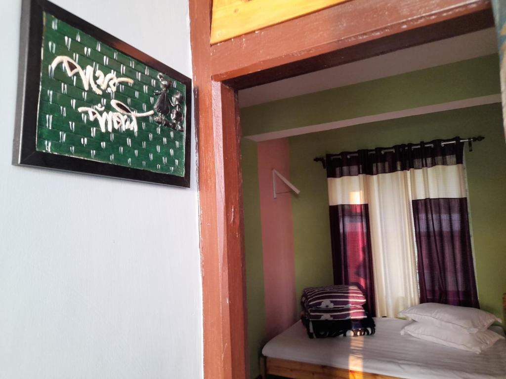 Postel nebo postele na pokoji v ubytování Pahar E Satyajit Homestay Ramdhura