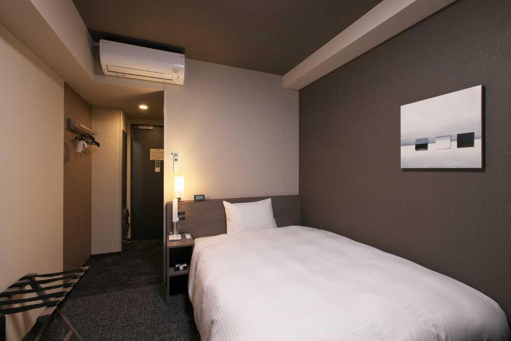 Postel nebo postele na pokoji v ubytování Hotel Route Inn Mitsuke -Nakanoshima Mitsuke Inter-