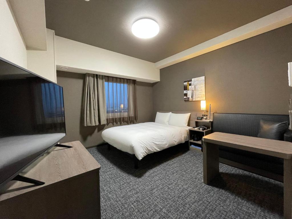 Postel nebo postele na pokoji v ubytování Hotel Route Inn Mitsuke -Nakanoshima Mitsuke Inter-