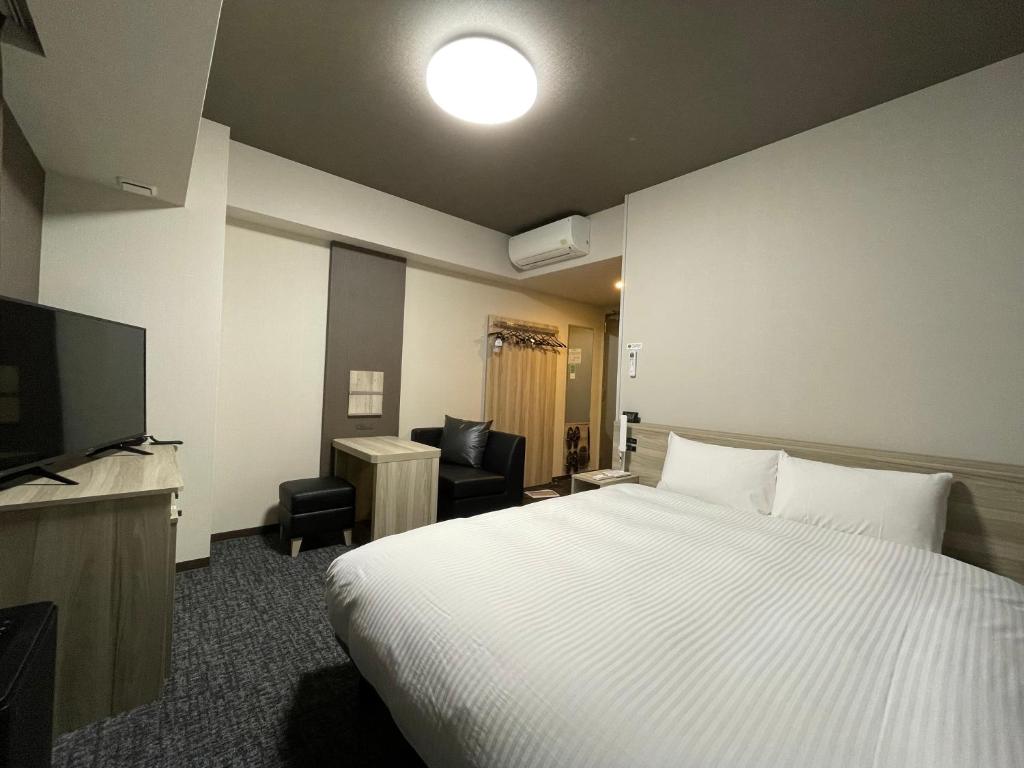 Postel nebo postele na pokoji v ubytování Hotel Route Inn Mitsuke -Nakanoshima Mitsuke Inter-