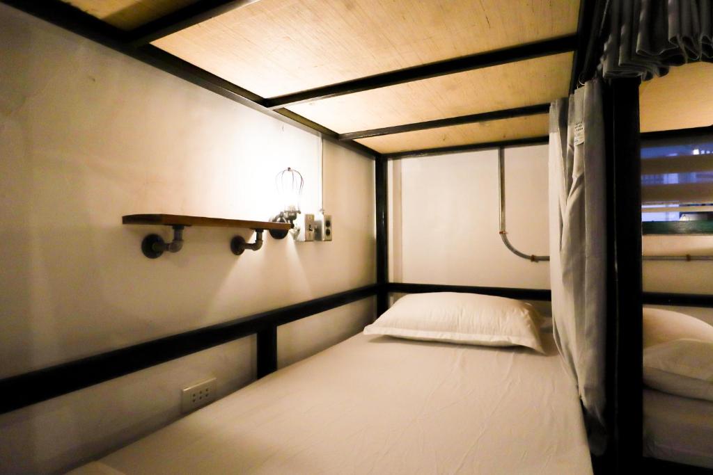 Uma cama ou camas num quarto em Ocean Breeze Hostel by Daily Sweet