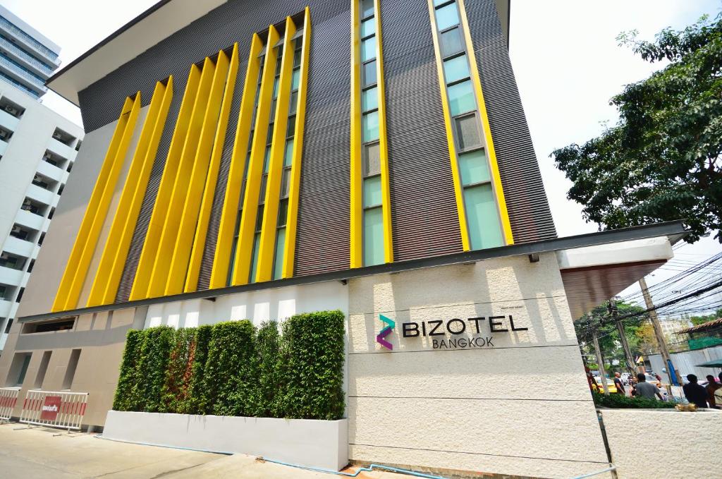 a building with a hotel on the side of it at Bizotel Premier Hotel & Residence in Bangkok
