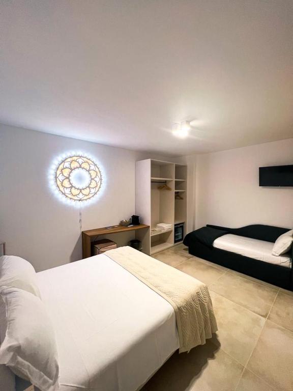 Postel nebo postele na pokoji v ubytování Olea Relais