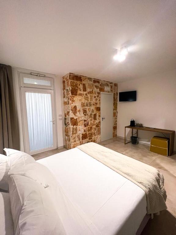 Postel nebo postele na pokoji v ubytování Olea Relais