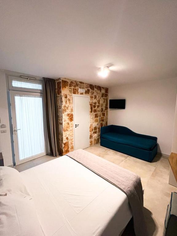 Postel nebo postele na pokoji v ubytování Olea Relais