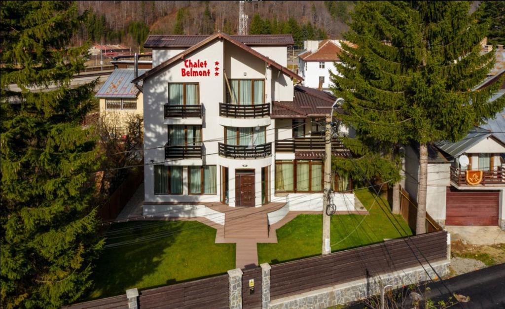 an aerial view of a large house in the mountains at Chalet Belmont in Azuga