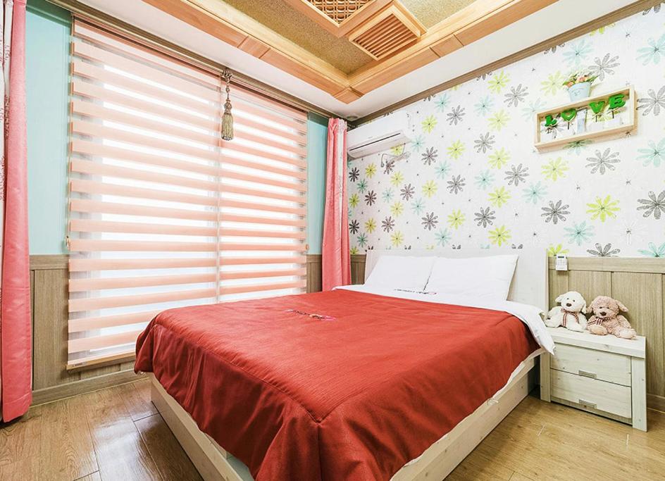 Postel nebo postele na pokoji v ubytování Ddeulae Pension