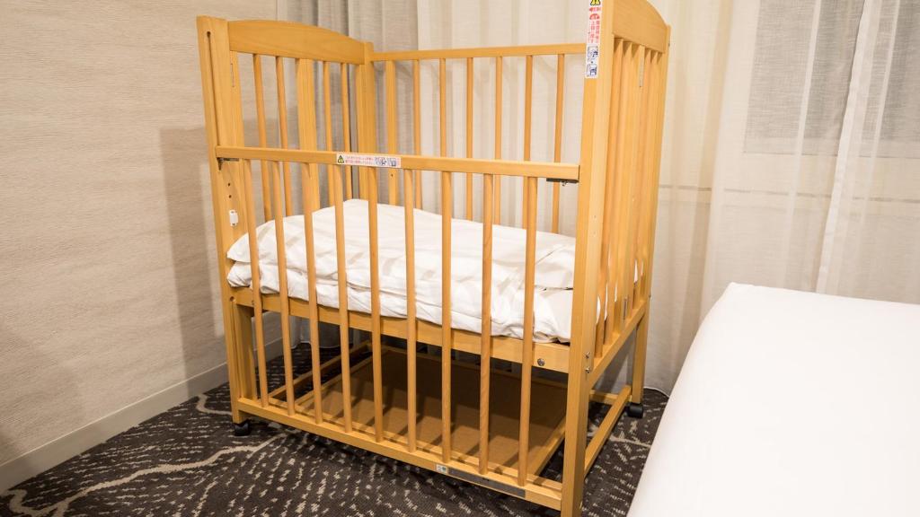 Postel nebo postele na pokoji v ubytování JR-East Hotel Mets Kamakura Ofuna