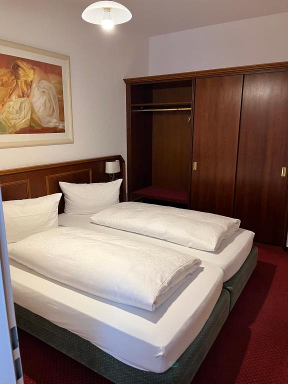 Postel nebo postele na pokoji v ubytování Hotel Seeperle