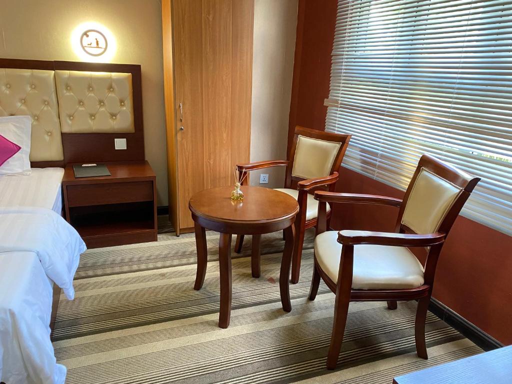 Postel nebo postele na pokoji v ubytování Sundale Hotel