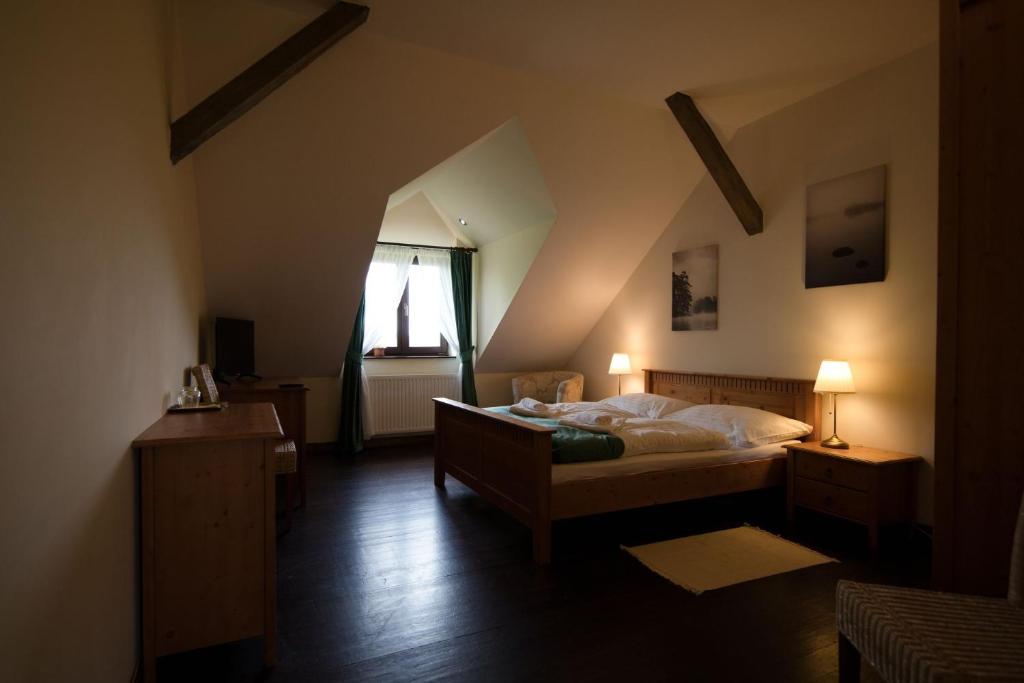 Postel nebo postele na pokoji v ubytování Hotel Buchlov