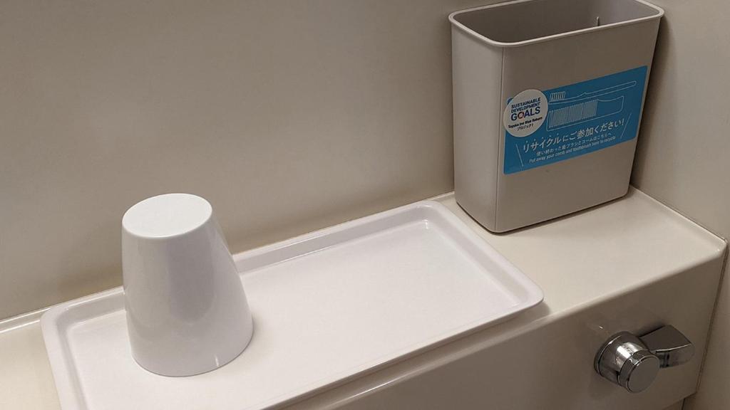 a white counter with a box on top of it at Toyoko Inn Osaka Itami Airport in Toyonaka