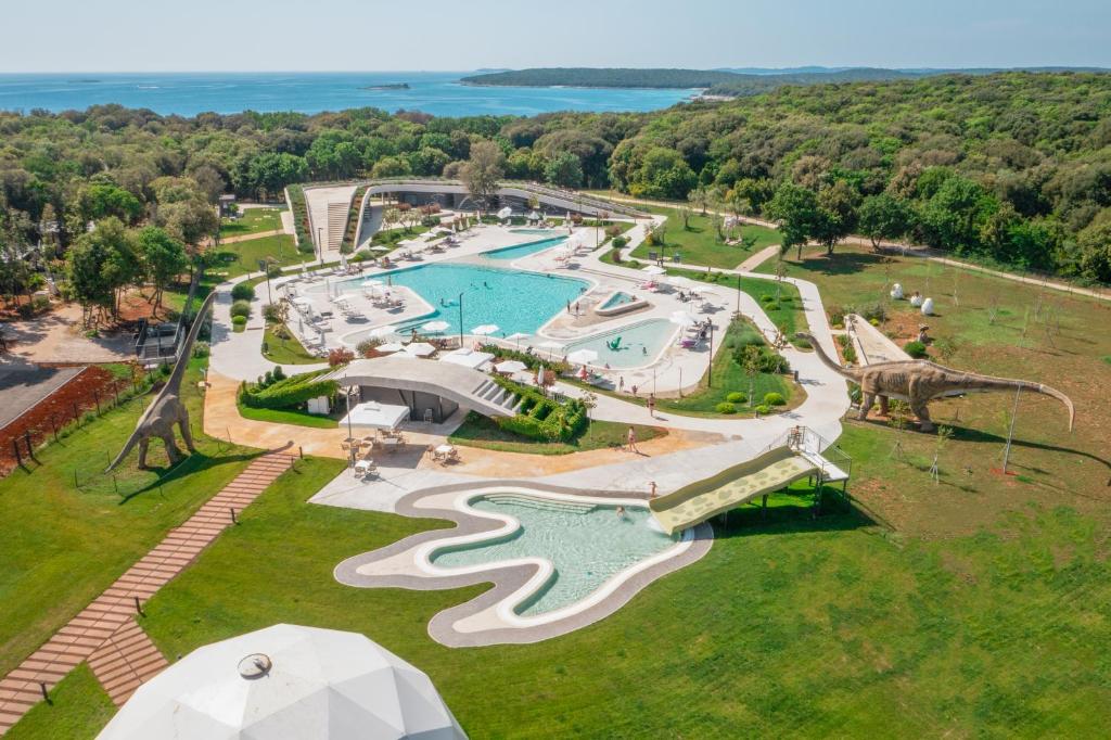 an aerial view of a resort with a swimming pool at Camping Homes Mon Perin in Bale