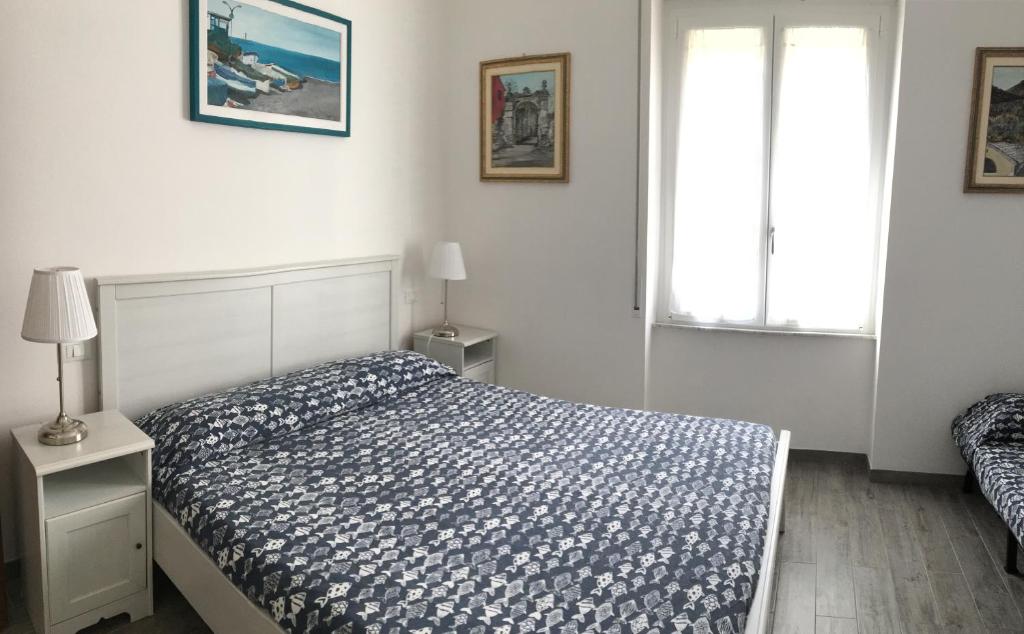 Posteľ alebo postele v izbe v ubytovaní HOST IN LEVANTO - Maestrale con biciclette